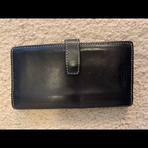 Medium black coach wallet. Snap front.